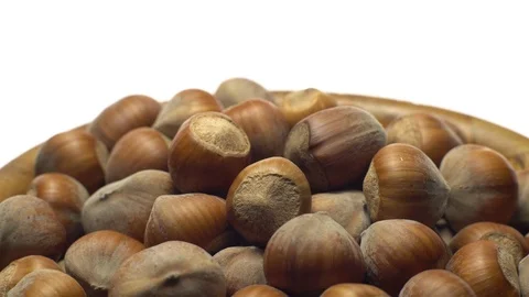 Hazel nuts in nutshell. Rotation. Closeup. Walnuts in a bowl. Selective focus. Video stock 101551780