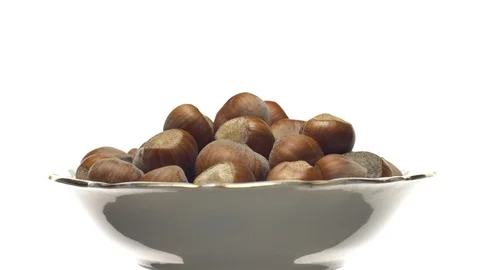 Hazel nuts in nutshell. Rotation. Closeup. Selective focus. Isolated on white. Stock Footage 101554880