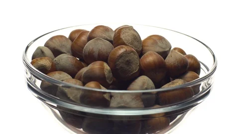 Hazel nuts in nutshell. Rotation. Closeup. Selective focus. Isolated on white. Stock Footage 101588127