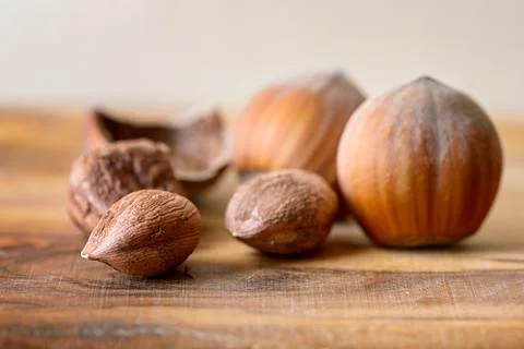 Hazelnut and nutshell on wood 스톡 사진