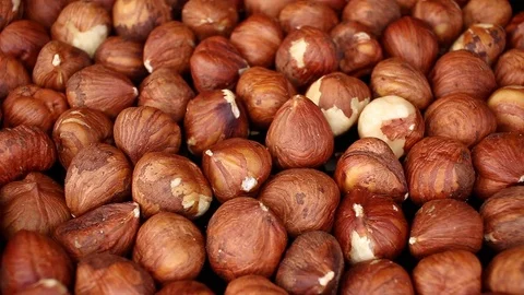 Hazelnut background hazelnuts footage video on slow motion rotating rolling Video stock 117358098