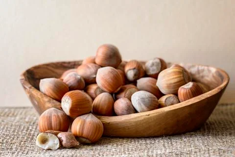 Hazelnut in basket on jute Stock Photos
