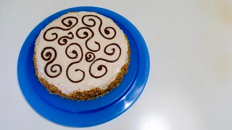 Hazelnut cake on a blue tray Stock Photos