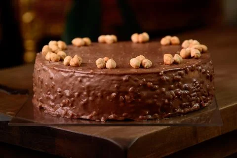 Hazelnut chocolate cake macro of hazelnut on wooden table Stock Photos