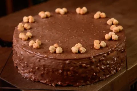 Hazelnut chocolate cake macro of hazelnut on wooden table Stock Photos