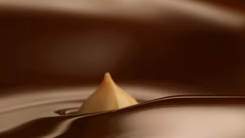 Hazelnut fall into chocolate bath5 Stock-Footage 94562477