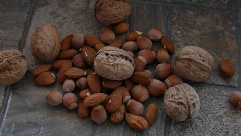 Hazelnut Falling to Almonds and Walnuts. Nuts Mix Detail. Food Macro Stock Footage 118954890
