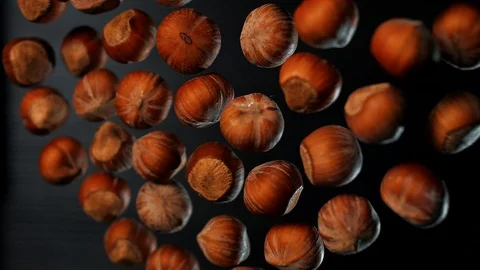 Hazelnut flies into the camera in slow motion. Macro. Food porn Stock Footage 109154422