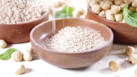 Hazelnut flour with whole nuts Video stock 171371999
