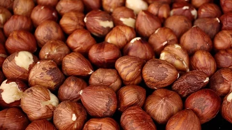 Hazelnut hazelnuts food closeup texture pattern seamless looping rotating video Stock Footage 102752106