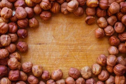 Hazelnut on the kitchen board. Stock Photos