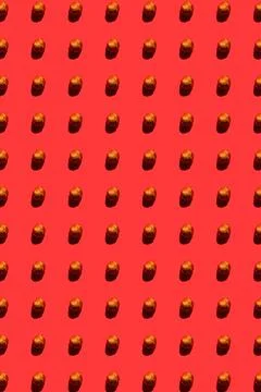 Hazelnut pattern on red background, colorful flat lay food texture top view 스톡 사진