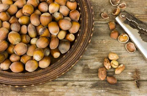 Hazelnut on rustic background Stock Photos