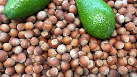 Hazelnuts and avocados Stock Footage 221840128