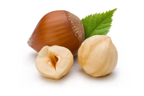 Hazelnuts and leaf on white background Stock Photos