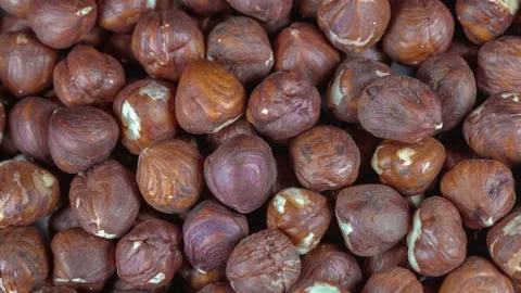 Hazelnuts on background - rotating and looping video Stock Footage 168909309