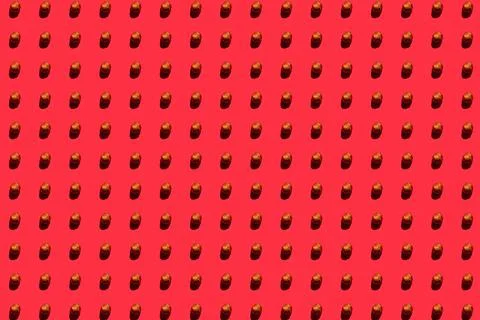 Hazelnuts background. A trendy sunlight pattern made of hazelnuts against a b Stock Photos