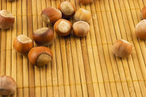 Hazelnuts on a bamboo mat Stock Photos