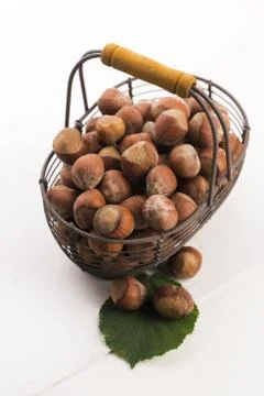 Hazelnuts in basket Stock Photos