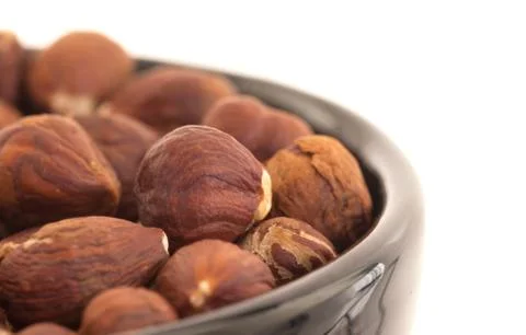 Hazelnuts in a bowl Stock Photos