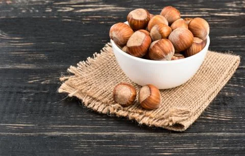 Hazelnuts in bowl Stock Photos