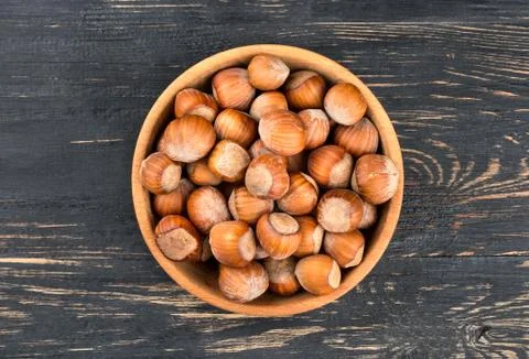 Hazelnuts in bowl Stock Photos