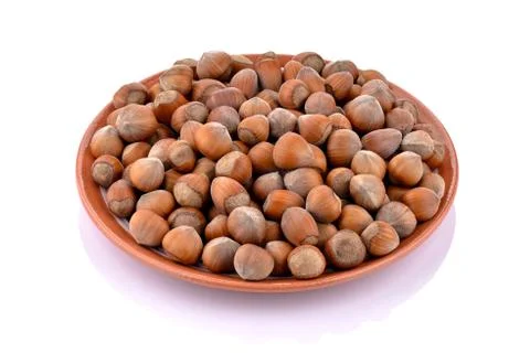 Hazelnuts on a ceramic plate Stock Photos