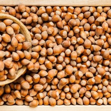 Hazelnuts close-up shot from above Stock Photos