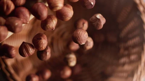 Hazelnuts falling into a basket Stock Footage 152384110