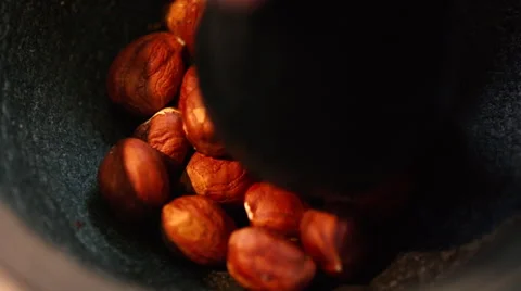 Hazelnuts falling in the mortar. slow motion Stock Footage 54648529