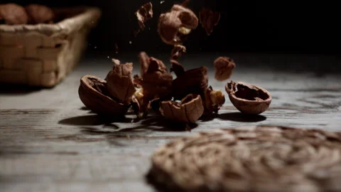 Hazelnuts falling on a slate table with walnuts Stock Footage 152383498