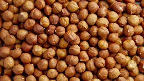 Hazelnuts heap rotating. Organic snack. Pile of hazelnuts without shell. Video stock 291631463