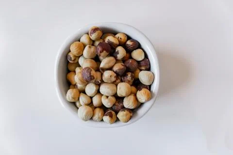 Hazelnuts isolated in a white pot Stock Photos
