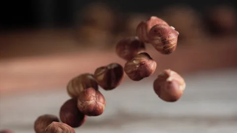 Hazelnuts jumping in the air Stock Footage 152383228