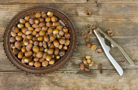 Hazelnuts with nutcracker Stock Photos