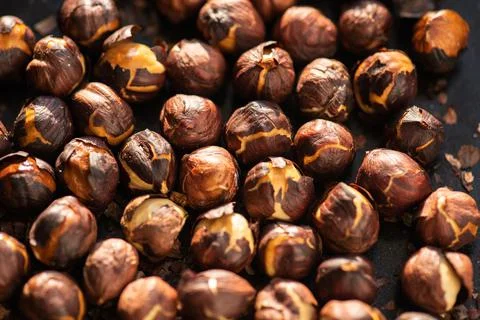 Hazelnuts roasted in an oven. Stock Photos