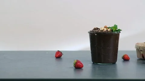 Hazelnuts rolls on the table on the backgroound. Heathy chocolate dessert with Video stock 132501358