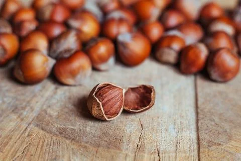 Hazelnuts on rustic background Stock Photos