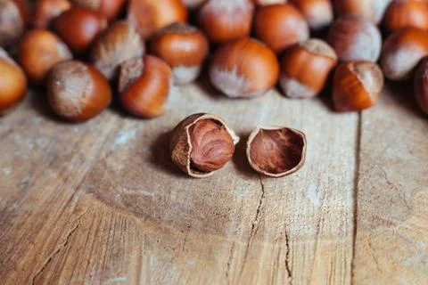 Hazelnuts on rustic background Stock Photos