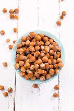 Hazelnuts on rustic wooden background Stock Photos