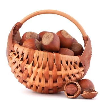 Hazelnuts in wicker basket Stock Photos