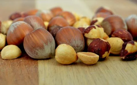Hazelnuts on wood Stock Photos
