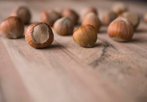 Hazelnuts on wooden background Stock Photos