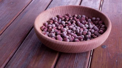 Hazelnuts on the wooden table Stock Footage 239016977