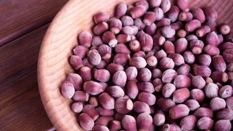 Hazelnuts on the wooden table Stock Footage 286840102