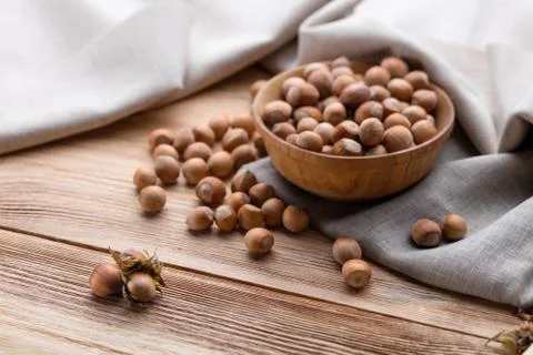 Hazelnuts on wooden table Фото