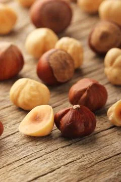 Hazelnuts on wooden table Stock Photos