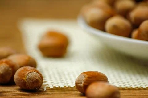 Hazelnuts on wooden table Stock Photos