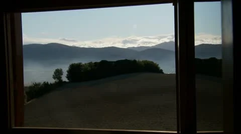 Hazey landscape through window Stock Footage 8946658