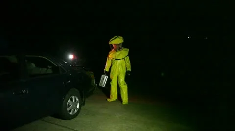 Hazmat cautiously looking around moving forward Stock Footage 11518481